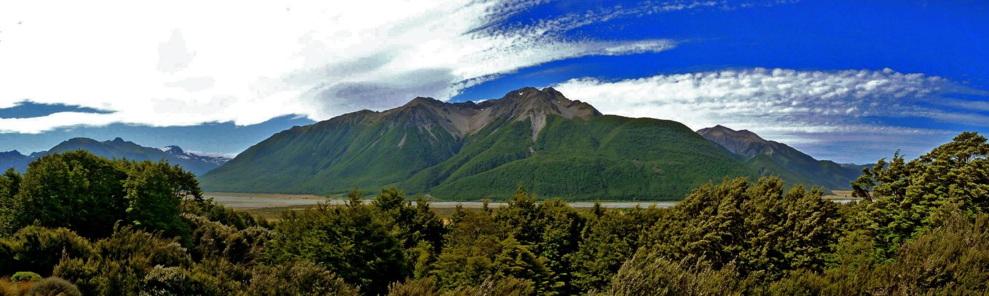 Panoramic view of the Southern Alps and native forest near Wilderness Lodge Arthur’s Pass.